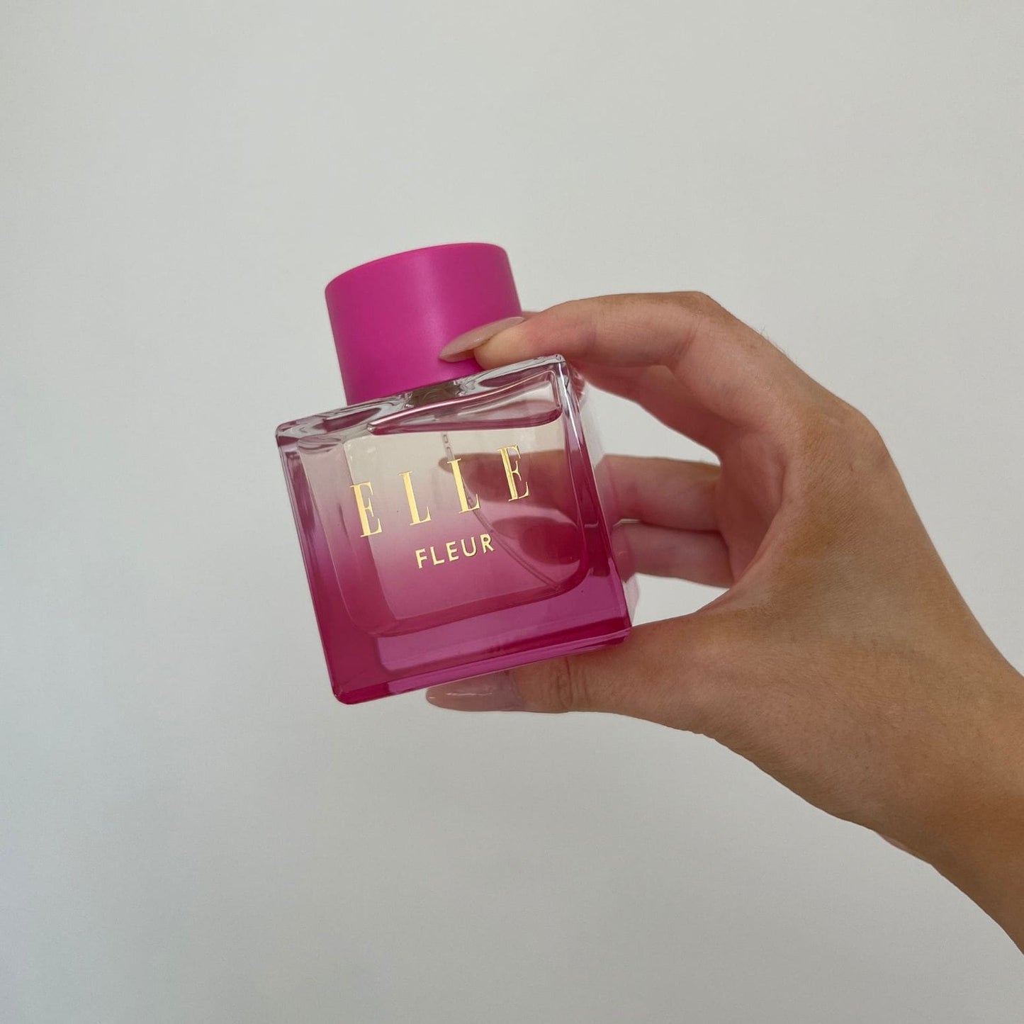 Packshot of Fleur fragrance by ELLE Parfums. A pink, girly bottle embodies a fruity, floral, and gourmand scent—perfect as an everyday eau de parfum for ladies and young women seeking a fresh, feminine fragrance.
