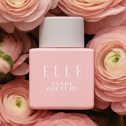 Pastel Pink ELLE Candy Couture perfume bottle on a floral background which reflect the vibe of the scent.