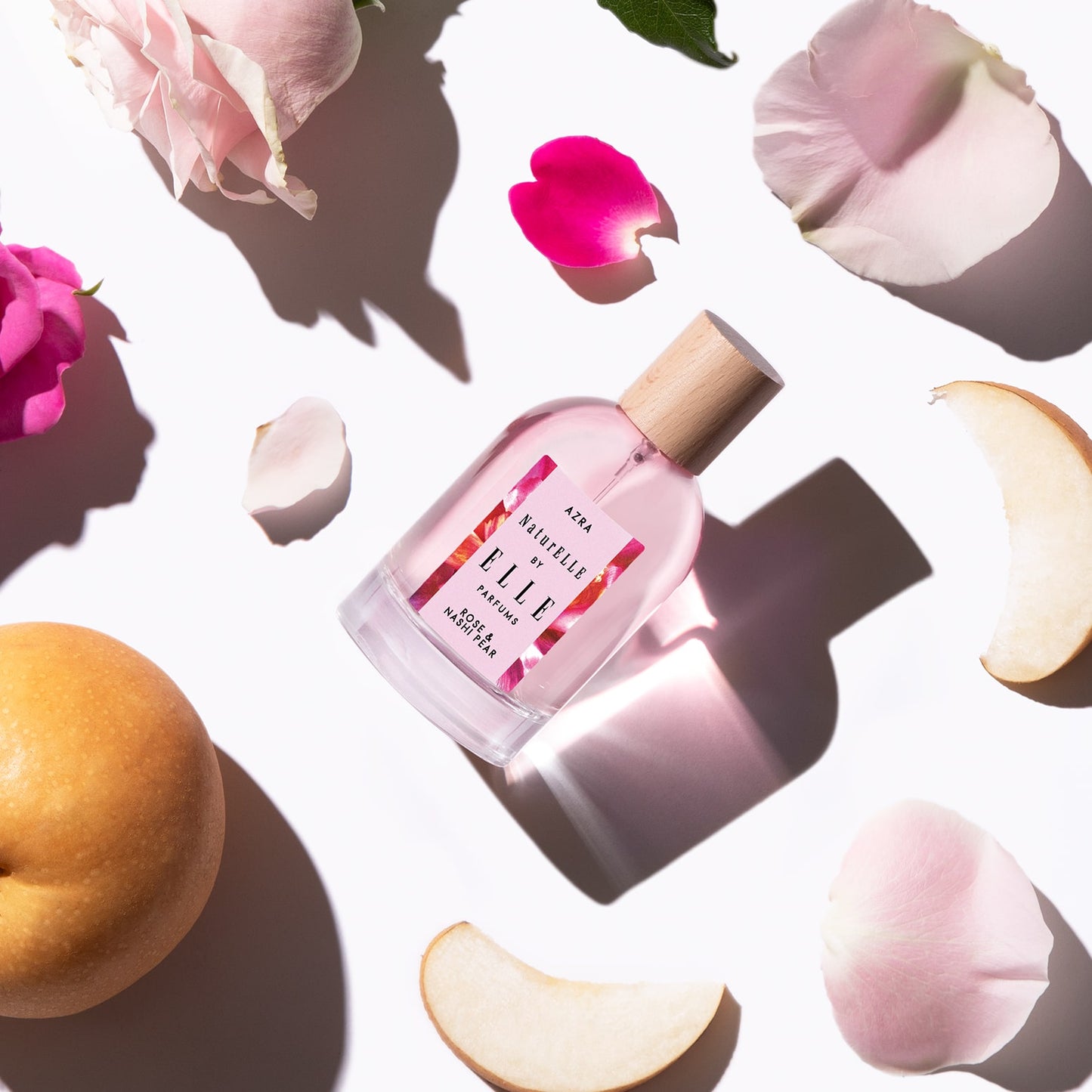 Lifestyle image of NaturELLE Azra by ELLE Parfums 100ml. The main ingredients in Azra Eau De Parfum are Rose & Nashi Pear. It's vegan, cruelty-free, naturally and ethically sourced. It's perfect for day and night.