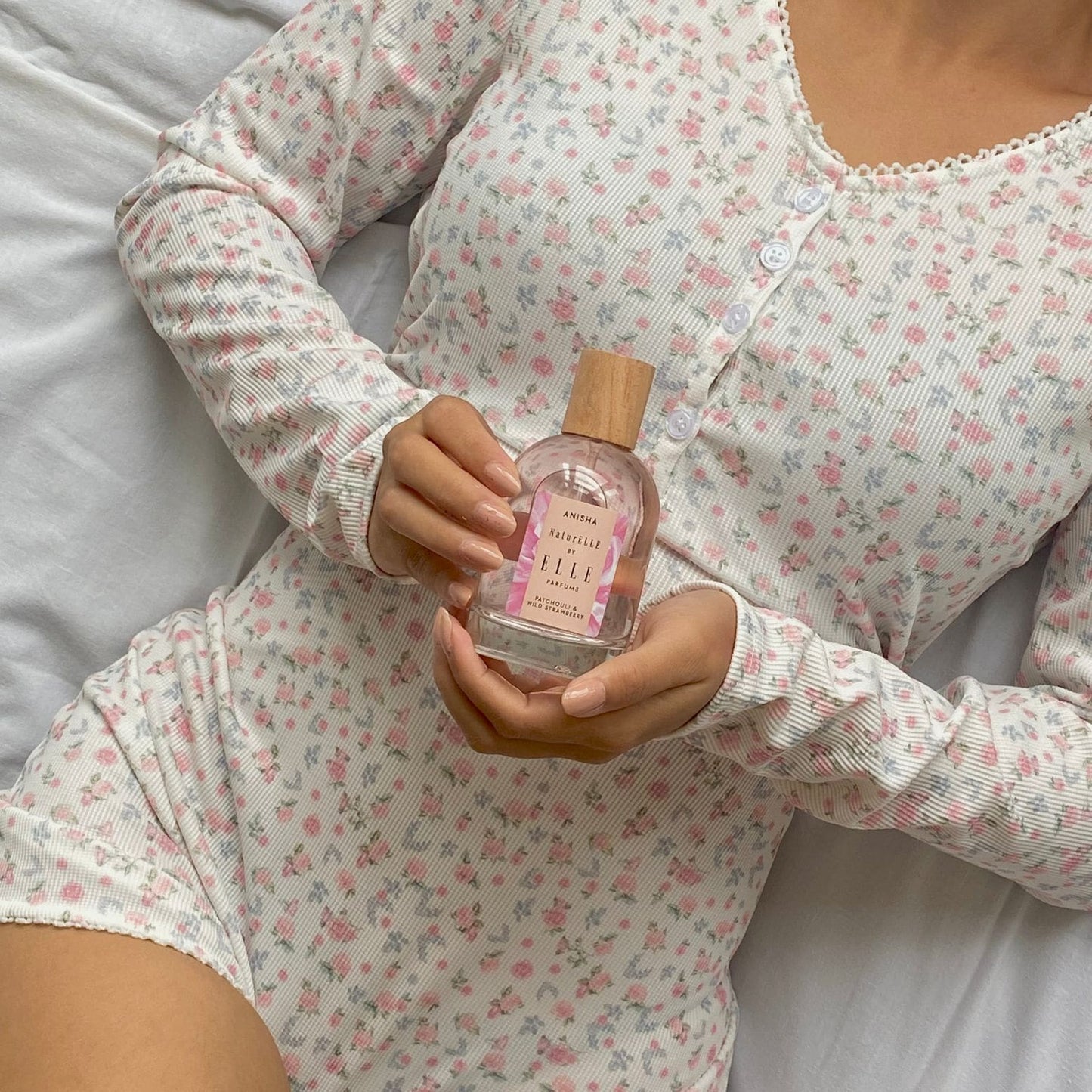 Lifestyle image of NaturELLE Anisha by ELLE Parfums 100ml. The main ingredients in Anisha Eau De Parfum are Patchouli & Wild Strawberry. It's vegan, cruelty-free, naturally and ethically sourced. It's perfect for day and night.