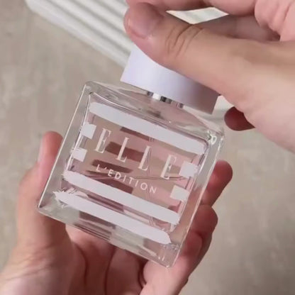 UGC video of girl spritzing L'Edition by ELLE Parfums, a fruity and floral eau de parfum inspired by the elegant Parisian lifestyle. This versatile fragrance is ideal for both day and night, cruelty-free, and suitable for vegans and vegetarians. Perfect for those seeking a chic and ethical scent.